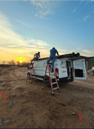 ROSENPER technicians working on-site at sunset