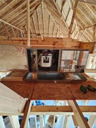 Electrical and A/C equipment installed in an attic space